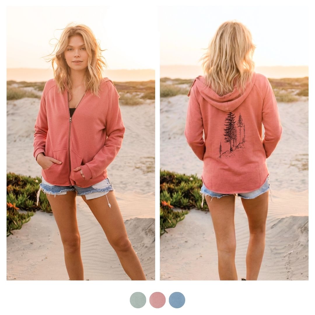 Front and back view of a woman at the beach wearing a dusty rose Cali Wave zip-up hoodie with a pine tree graphic on the back. - 3 trees planted with every order