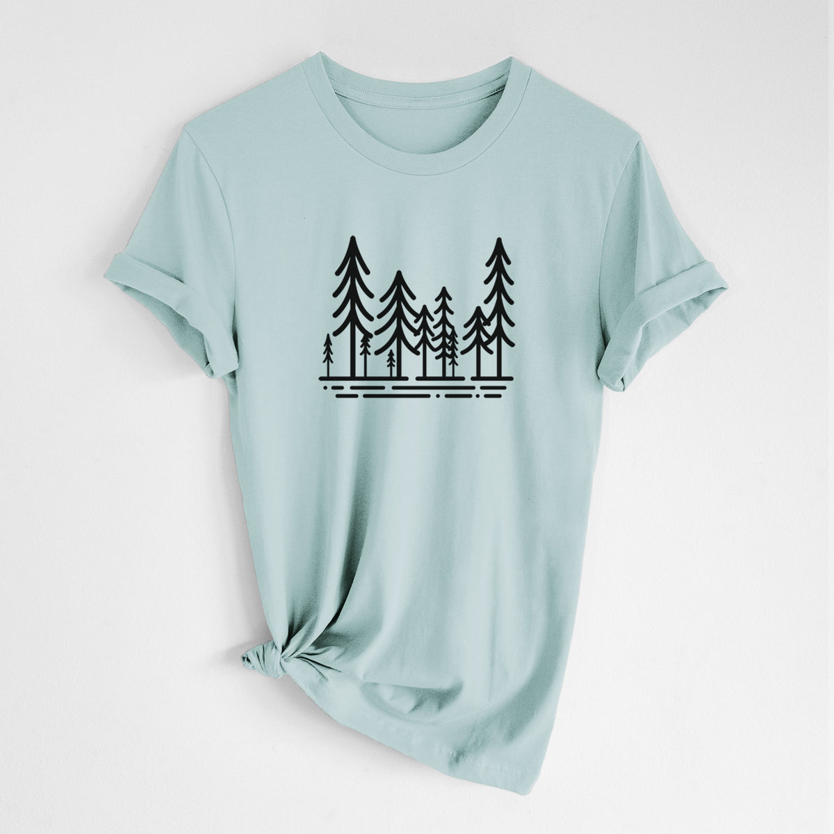 Dusty blue lightweight cotton t-shirt laid flat with the sleeves rolled, printed with bold black line art of ten simple pine trees above horizontal lines.