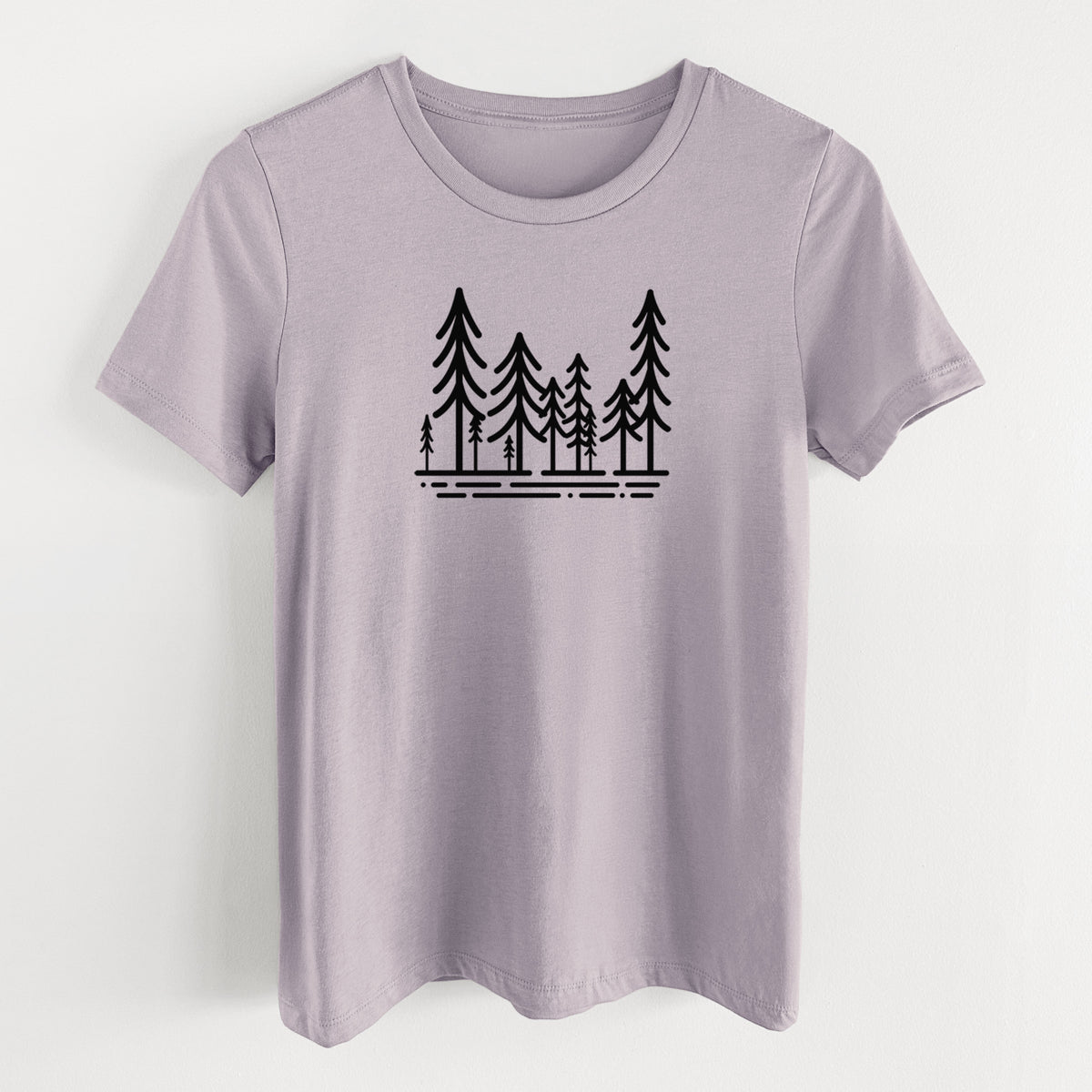Light violet women's relaxed fit cotton t-shirt laid flat, printed with bold black line art of ten simple pine trees above horizontal lines.