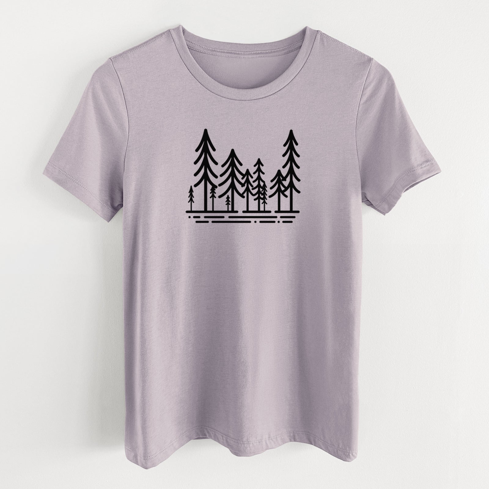 Light violet women's relaxed fit cotton t-shirt laid flat, printed with bold black line art of ten simple pine trees above horizontal lines.
