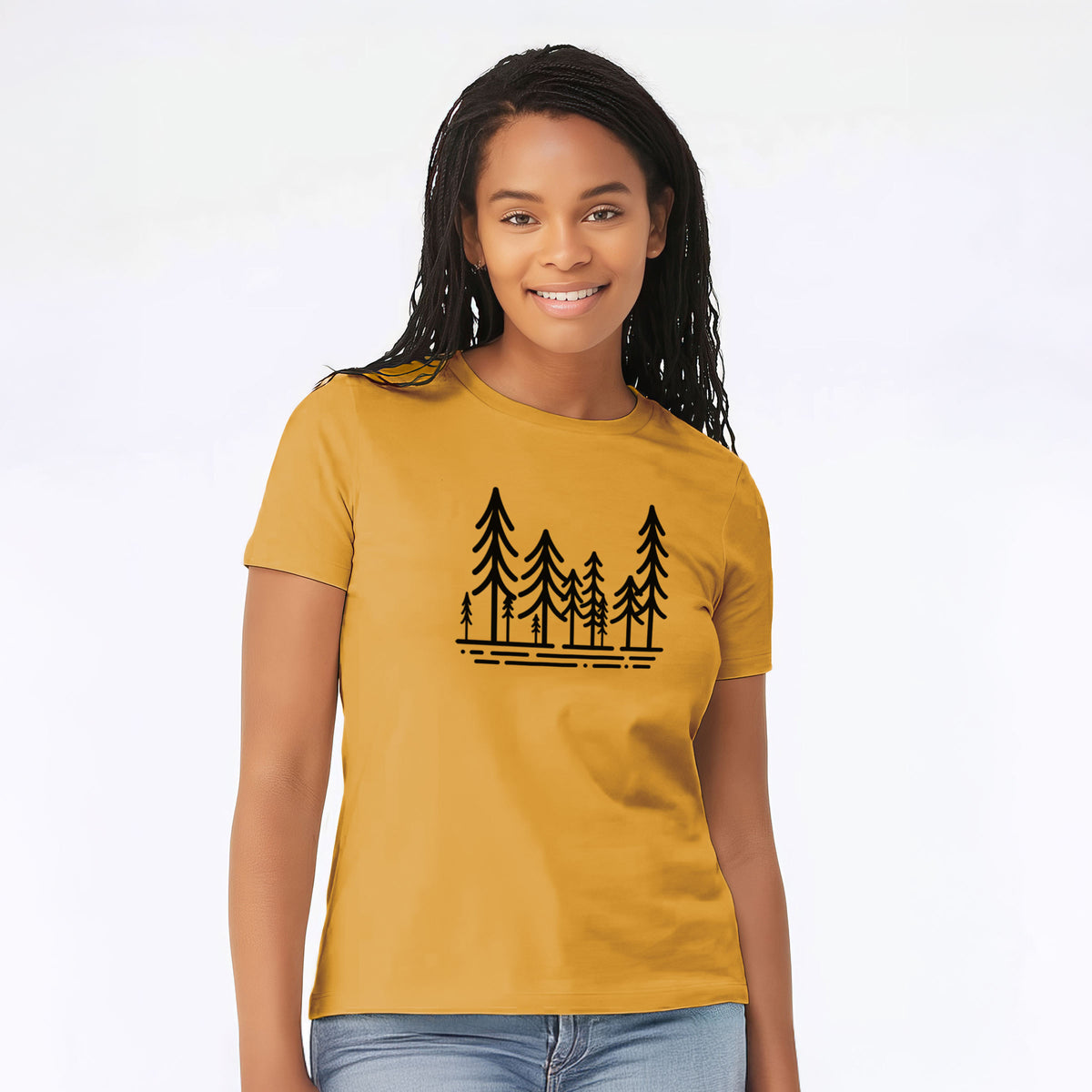 Woman wearing a mustard yellow women's relaxed fit cotton t-shirt printed with bold black line art of ten simple pine trees above horizontal lines.