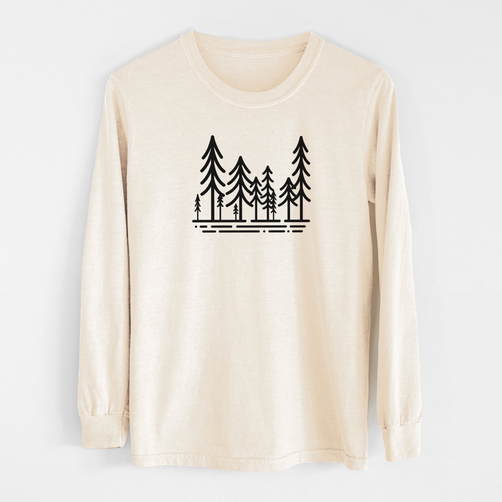Ivory Comfort Colors long sleeve shirt laid flat, printed with bold black line art of ten simple pine trees above horizontal lines.