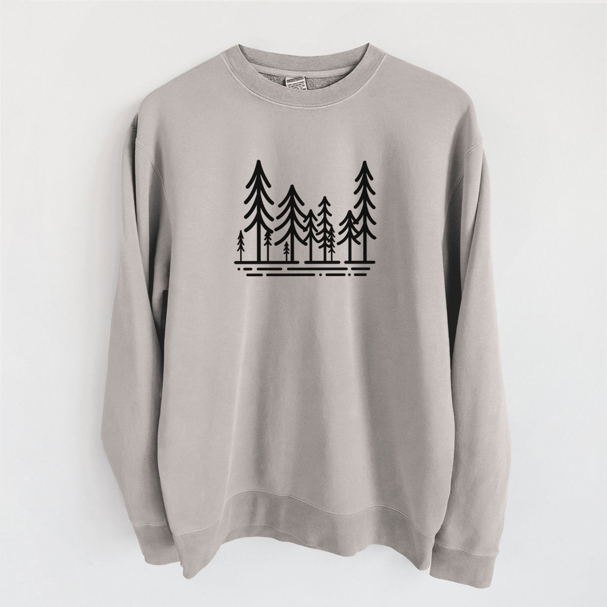 Cement grey pigment dyed crewneck sweatshirt laid flat, printed with bold black line art of ten simple pine trees above horizontal lines.