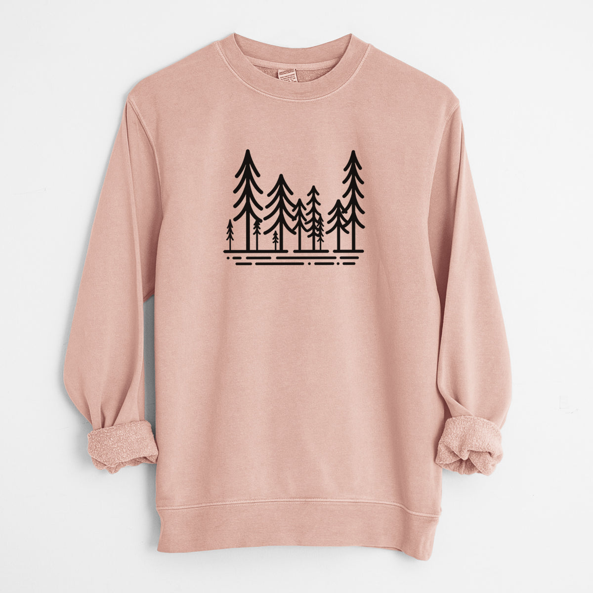 Dusty pink pigment dyed crewneck sweatshirt laid flat with the sleeves rolled, printed with bold black line art of ten simple pine trees above horizontal lines.