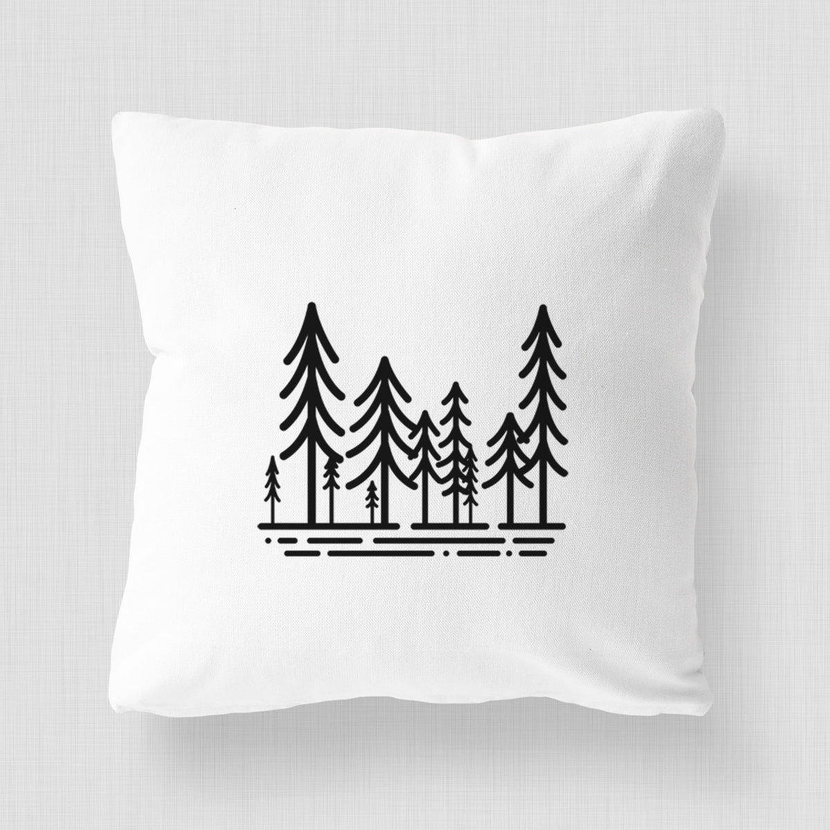 White pillow cover printed with bold black line art of ten simple pine trees above horizontal lines.