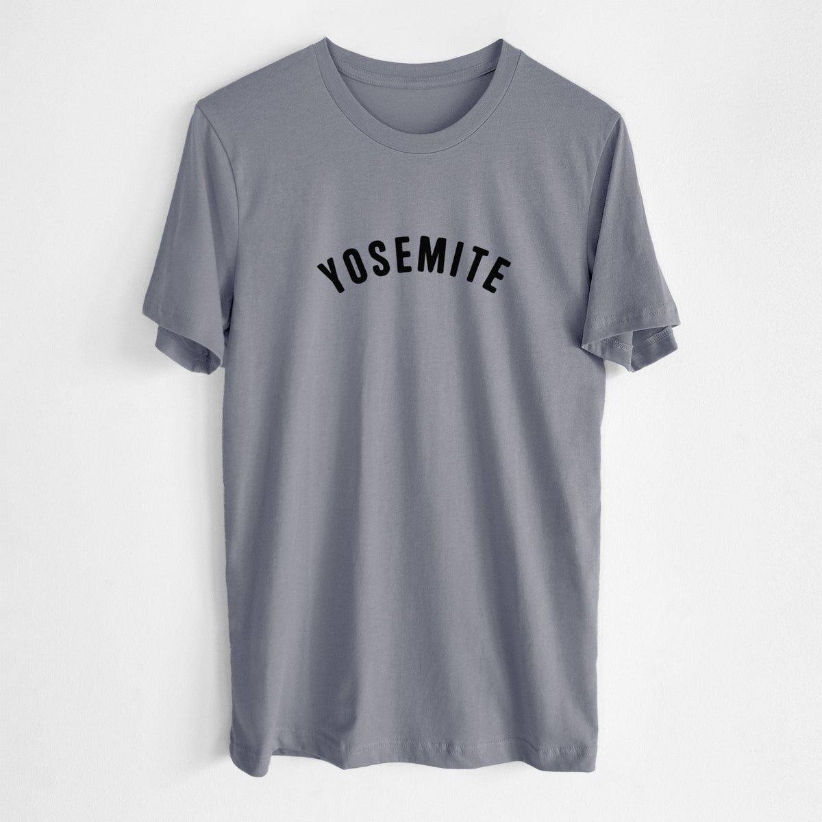 Storm grey lightweight cotton t-shirt laid flat, printed with the word Yosemite in bold black letters arched across the chest.