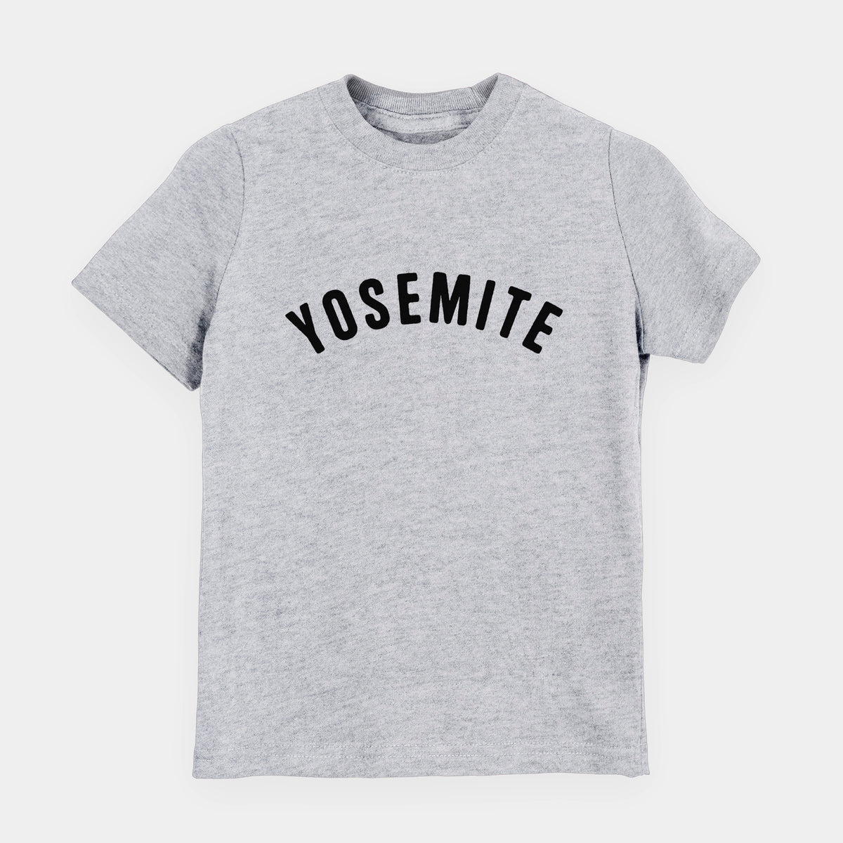 Heather grey youth t-shirt laid flat, printed with the word Yosemite in bold black letters arched across the chest.