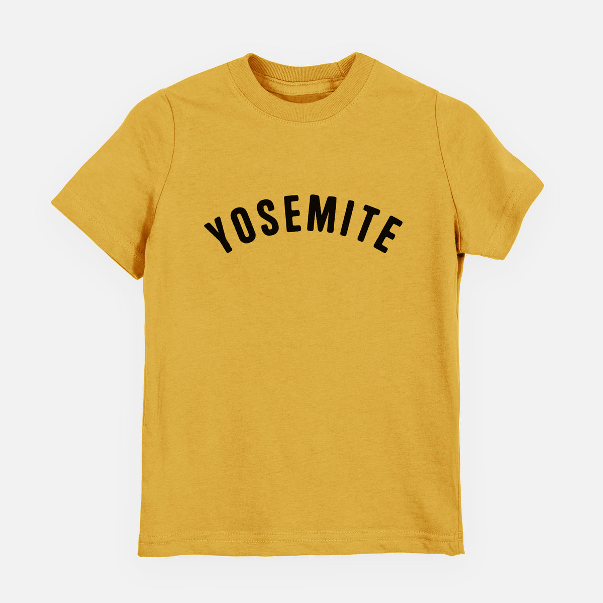 Honeycomb yellow youth t-shirt laid flat, printed with the word Yosemite in bold black letters arched across the chest.