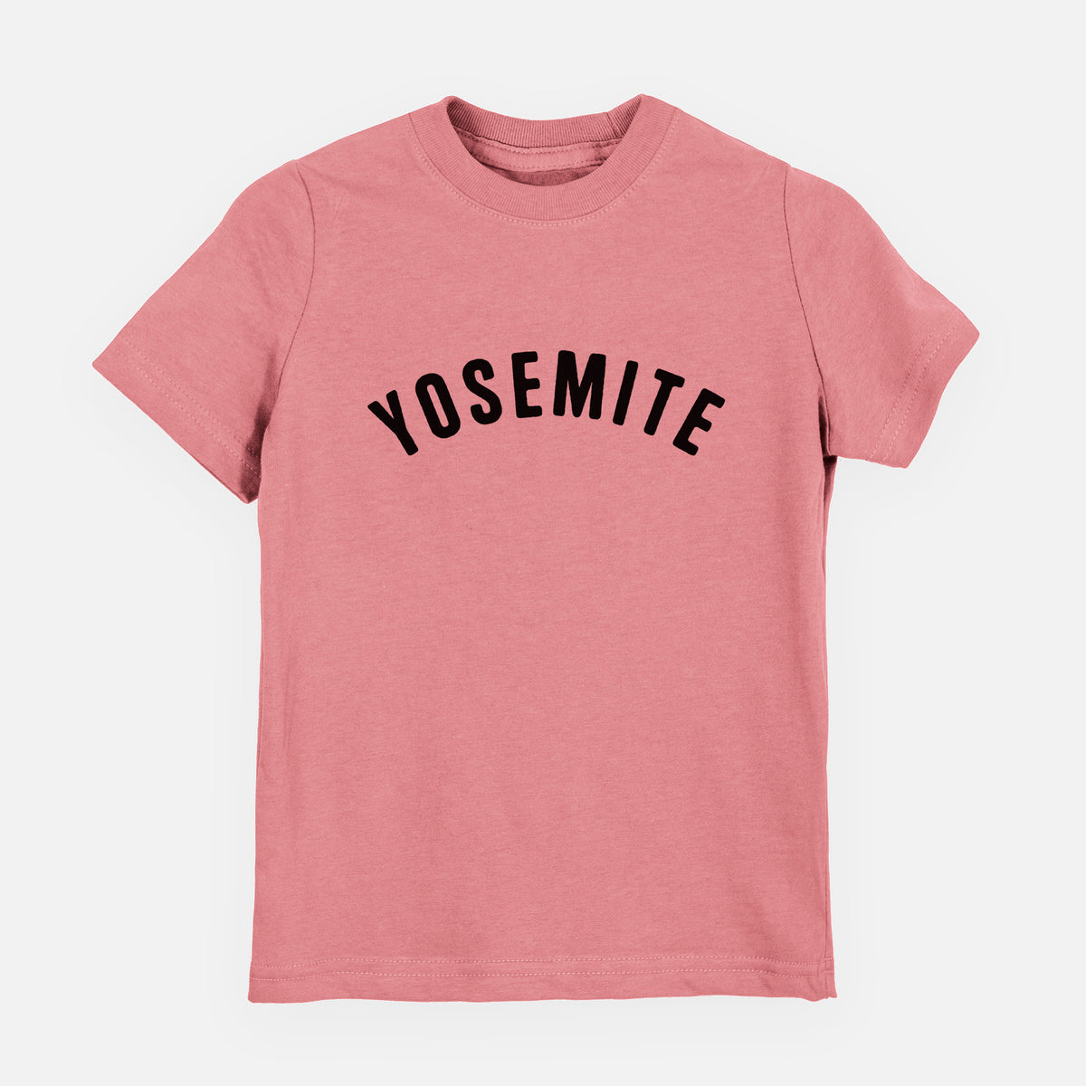 Mauve pink youth t-shirt laid flat, printed with the word Yosemite in bold black letters arched across the chest.