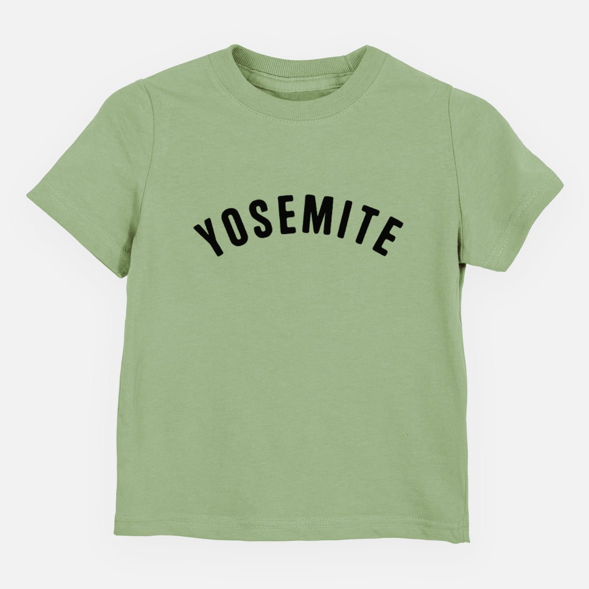 Sage green toddler t-shirt laid flat, printed with the word Yosemite in bold black letters arched across the chest.