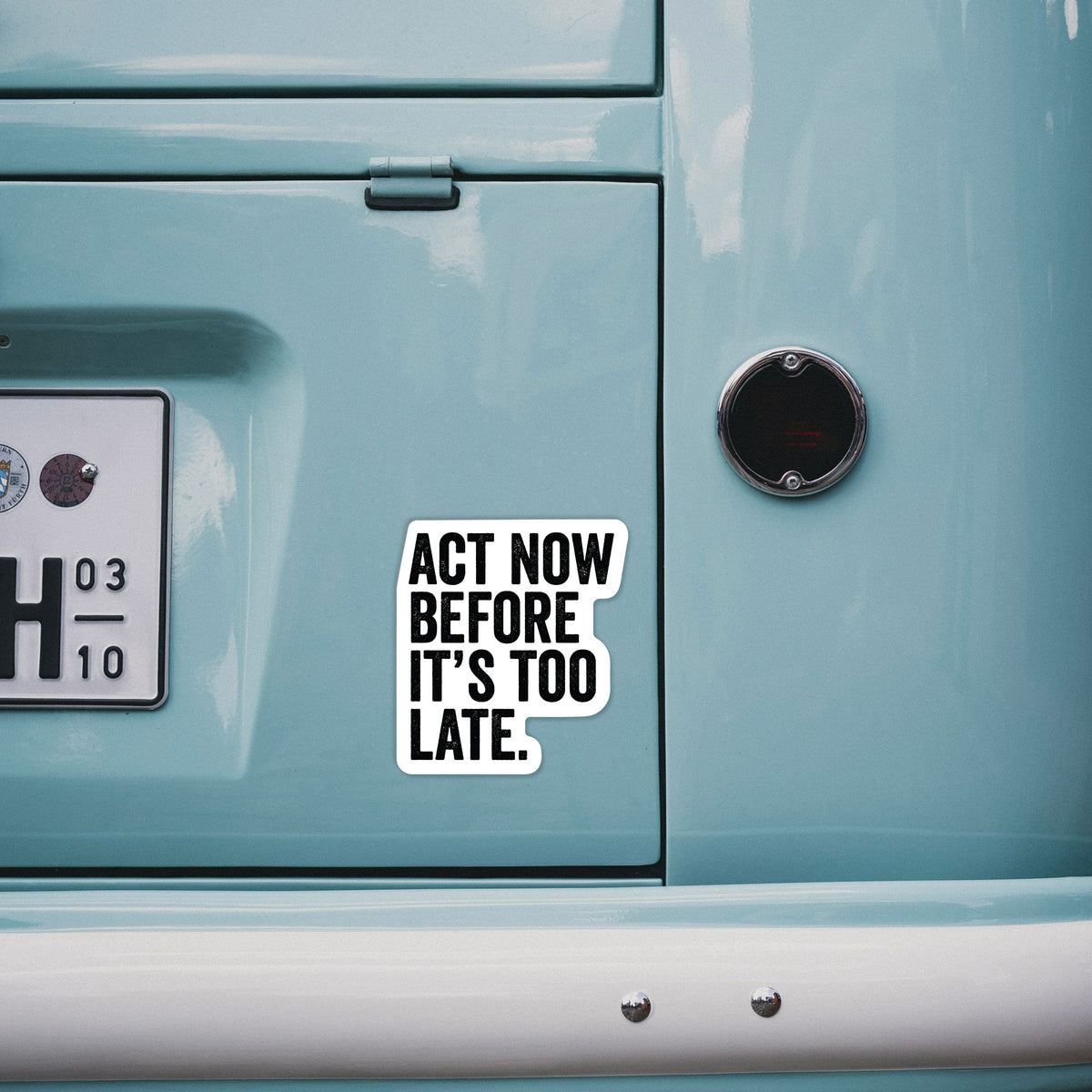 4 inch vinyl decal of bold black words reading Act Now Before It's Too Late on the back of a van.