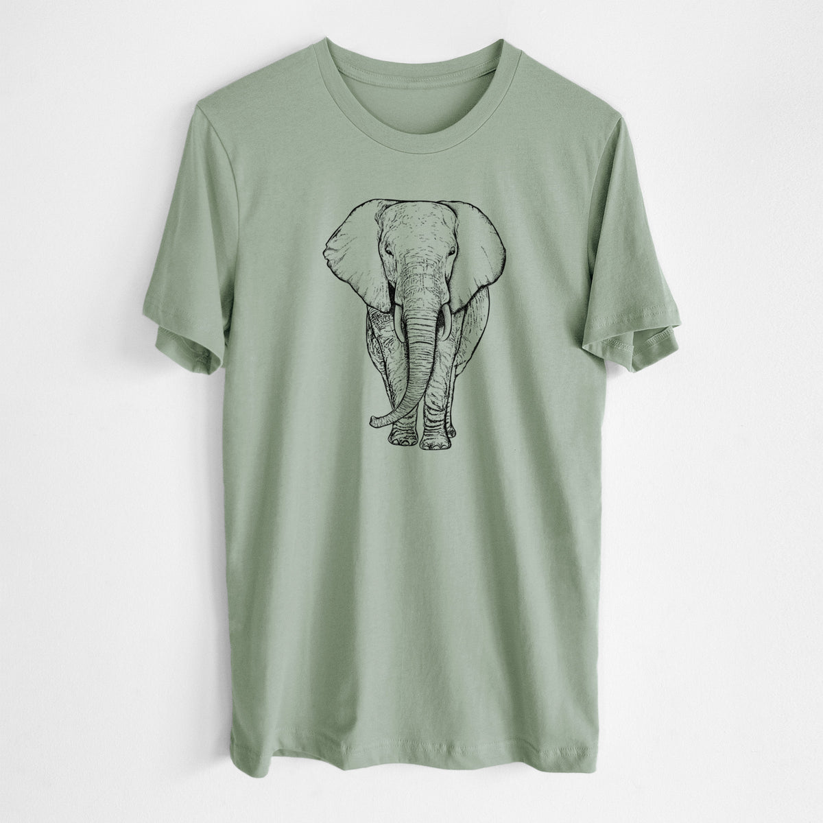 Sage green lightweight cotton t-shirt laid flat, printed with a black ink line drawing of an African elephant facing forward with large ears and tusks.