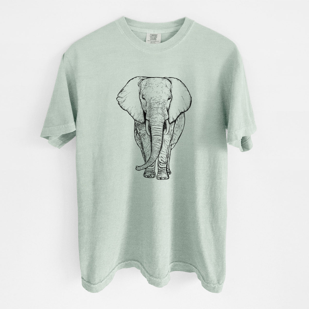 Bay green Comfort Colors t-shirt laid flat, printed with a black ink line drawing of an African elephant facing forward with large ears and tusks.