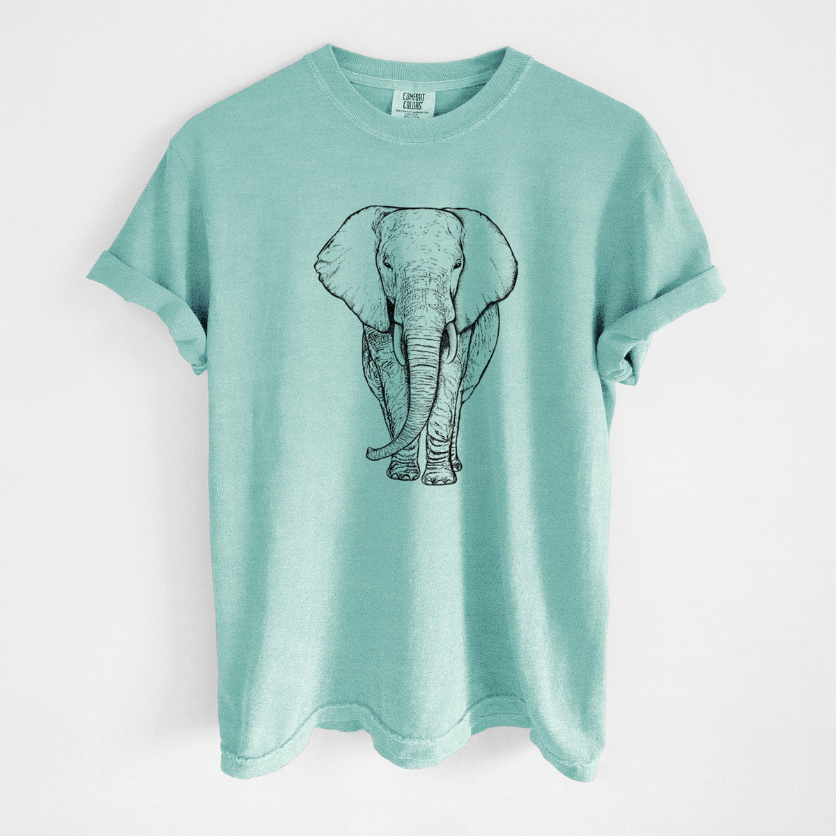 Chalky mint Comfort Colors t-shirt laid flat, printed with a black ink line drawing of an African elephant facing forward with large ears and tusks.