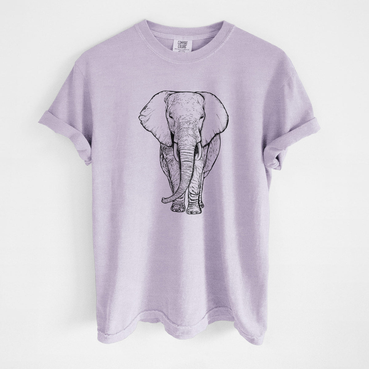 Orchid purple Comfort Colors t-shirt laid flat, printed with a black ink line drawing of an African elephant facing forward with large ears and tusks.