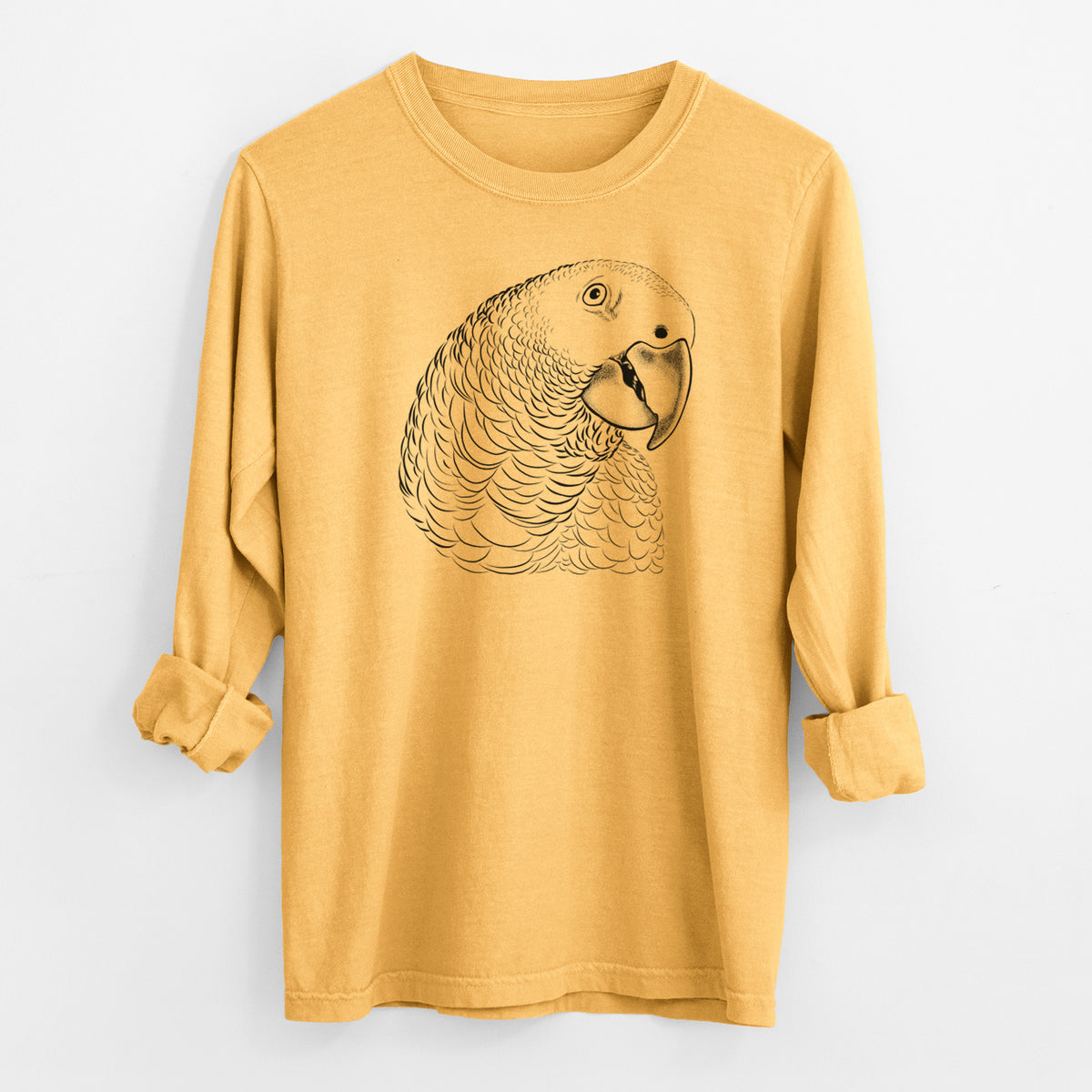 Golden wheat yellow Comfort Colors long sleeve shirt laid flat with the cuffs rolled, printed with a detailed black ink portrait of an African grey parrot's head.