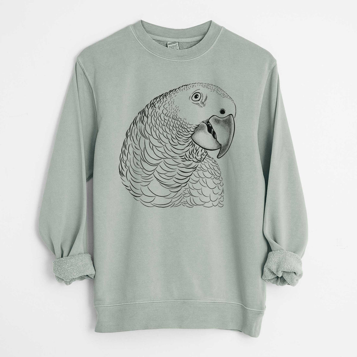 Sage green pigment dyed crewneck sweatshirt laid flat with the sleeves rolled, printed with a detailed black ink portrait of an African grey parrot's head.
