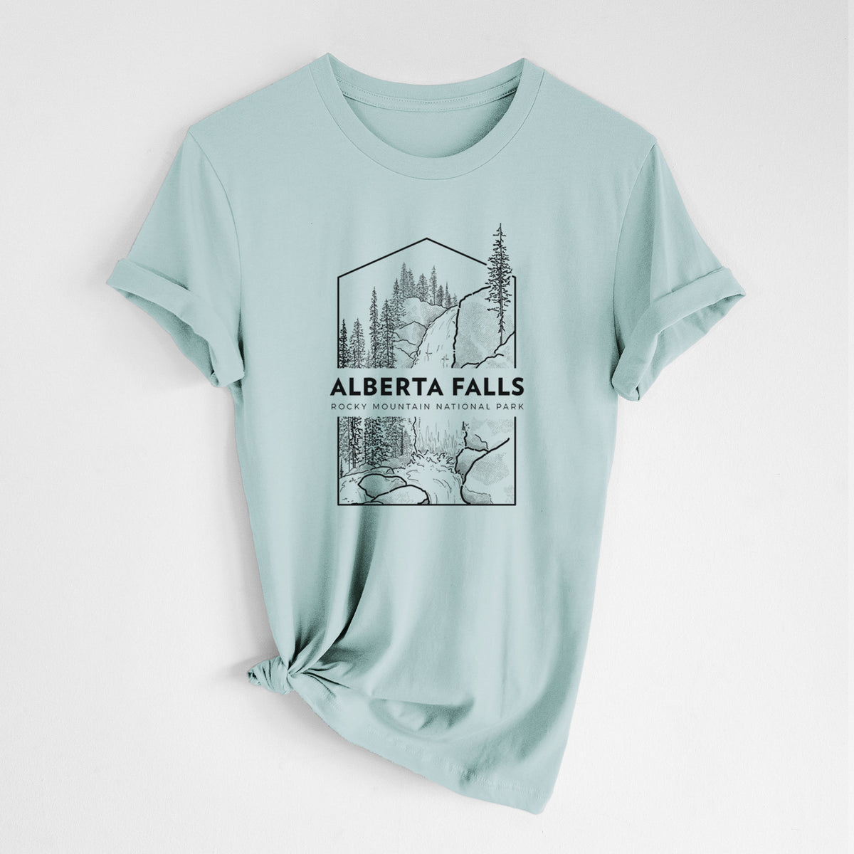 Dusty blue lightweight cotton t-shirt laid flat with the sleeves rolled, printed with a black line art badge of Alberta Falls with pine trees, with the words Alberta Falls, Rocky Mountain National Park.
