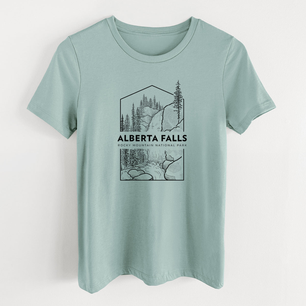 Dusty blue women's relaxed fit cotton t-shirt laid flat, printed with a black line art badge of Alberta Falls with pine trees, with the words Alberta Falls, Rocky Mountain National Park.