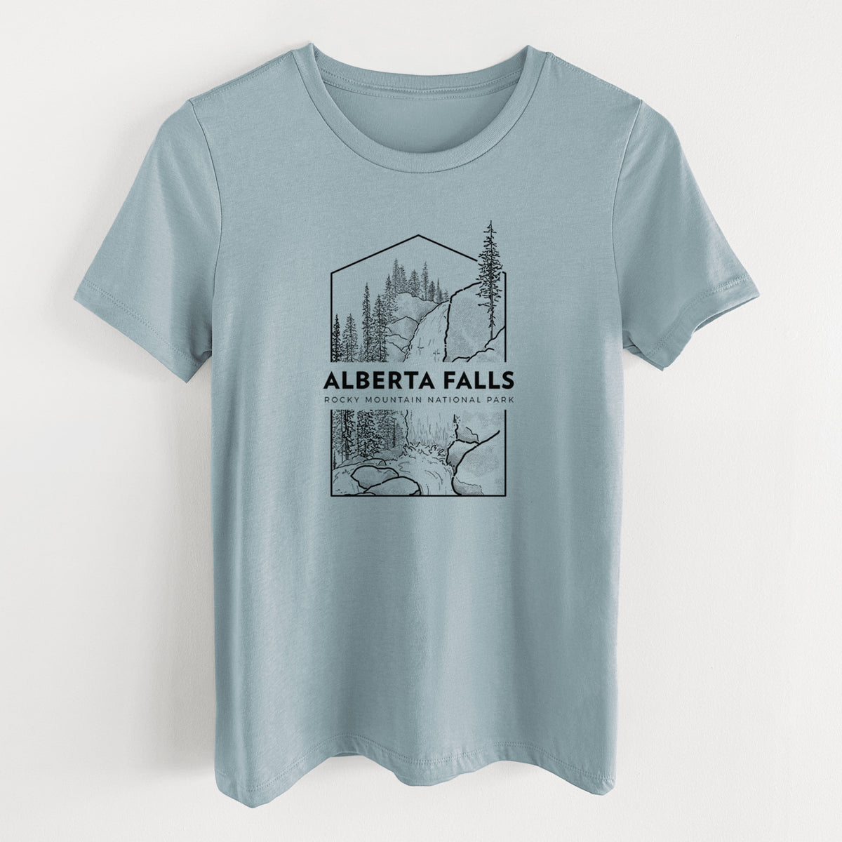 Vintage denim women's relaxed fit cotton t-shirt laid flat, printed with a black line art badge of Alberta Falls with pine trees, with the words Alberta Falls, Rocky Mountain National Park.