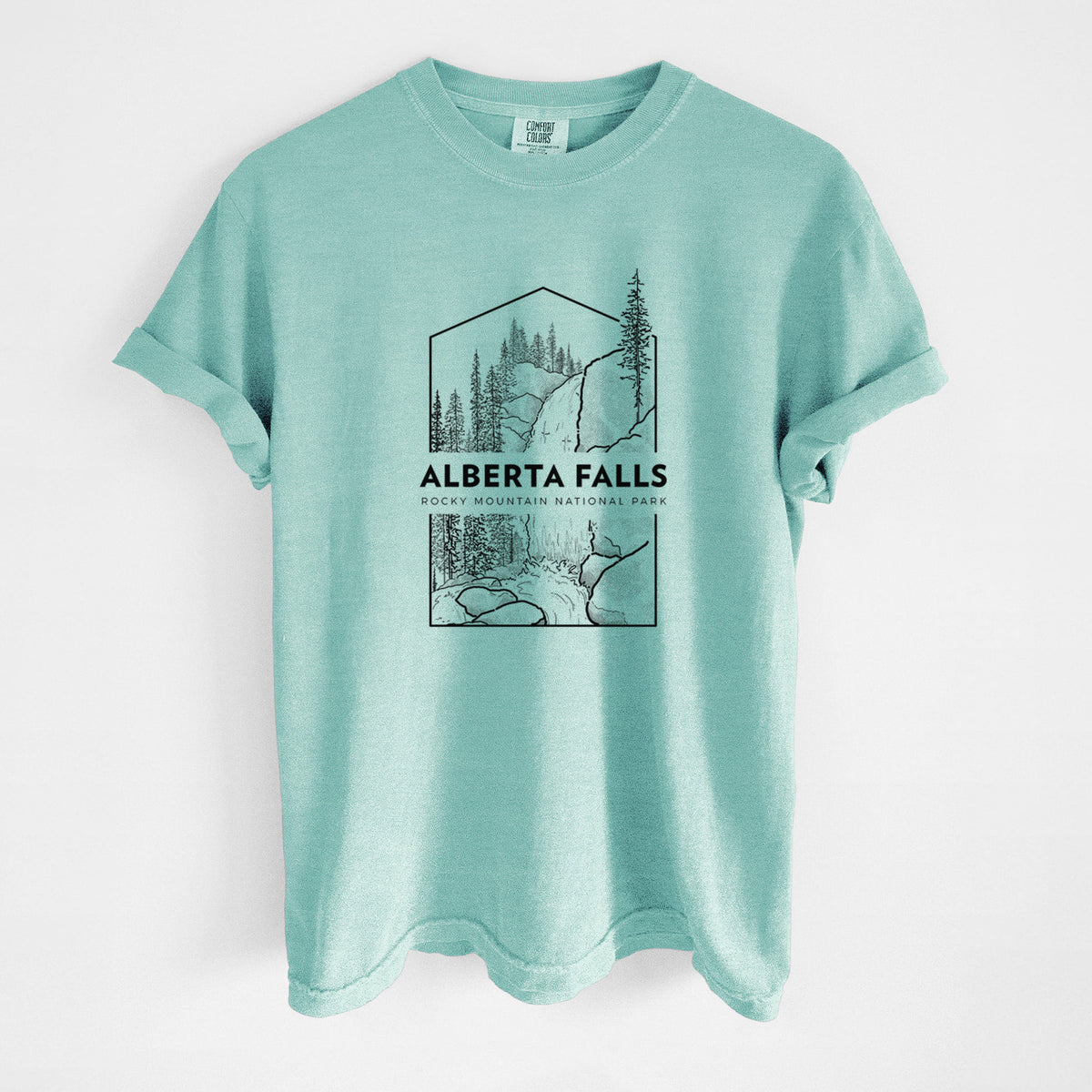 Chalky mint Comfort Colors t-shirt laid flat, printed with a black line art badge of Alberta Falls with pine trees, with the words Alberta Falls, Rocky Mountain National Park.