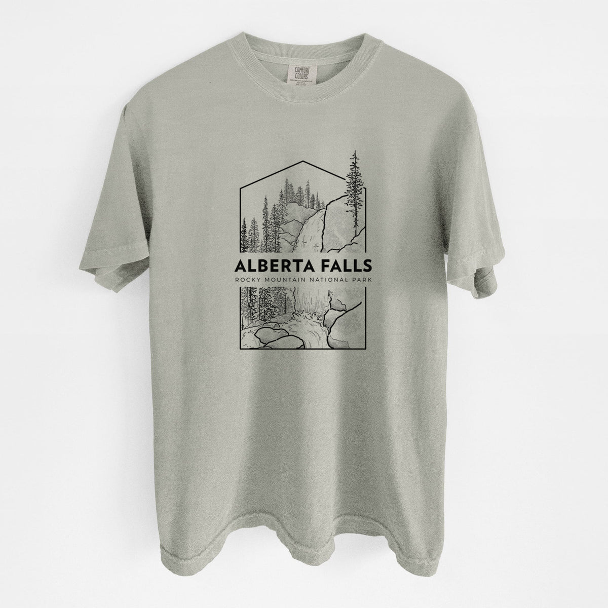 Sandstone beige Comfort Colors t-shirt laid flat, printed with a black line art badge of Alberta Falls with pine trees, with the words Alberta Falls, Rocky Mountain National Park.