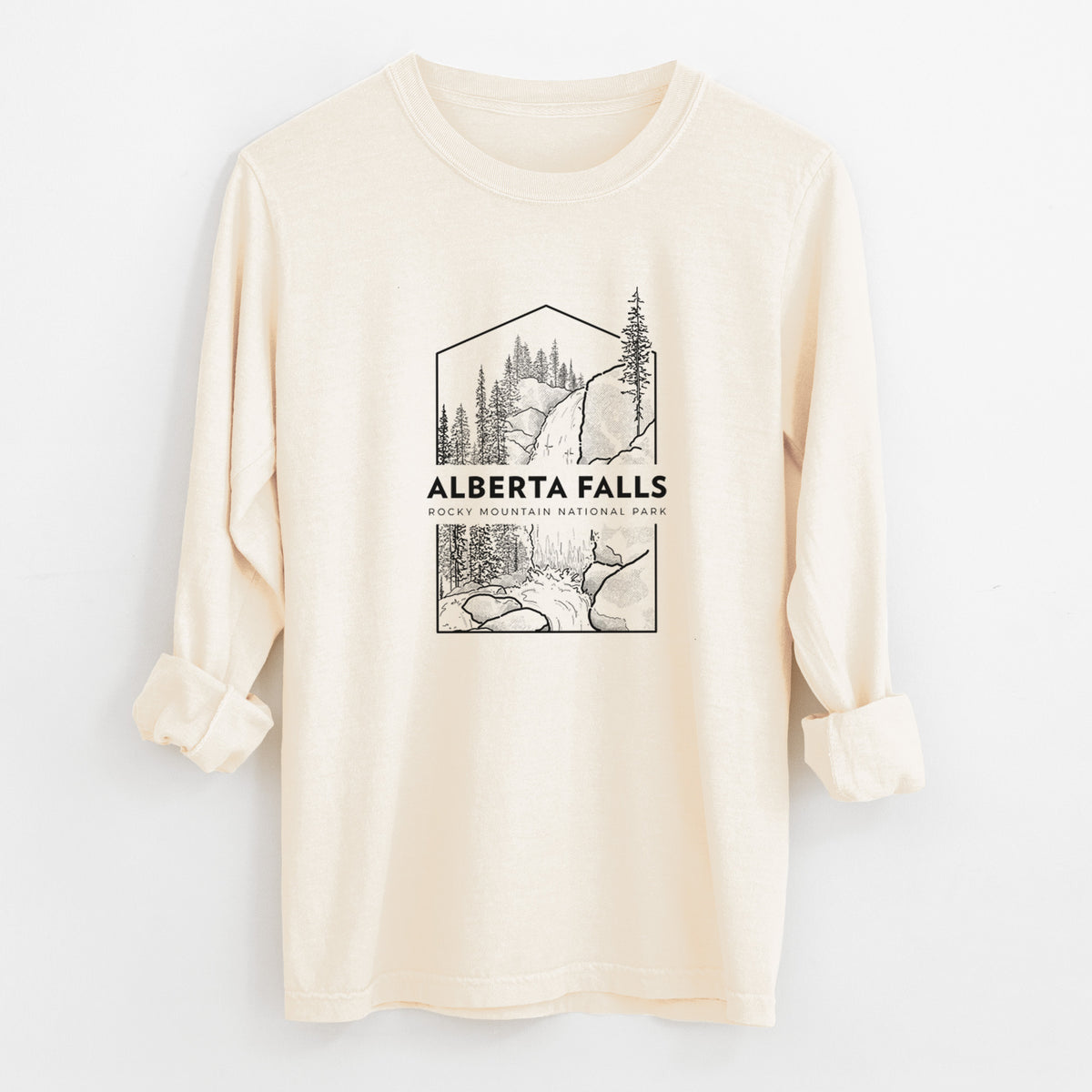 Ivory Comfort Colors long sleeve shirt laid flat with the cuffs rolled, printed with a black line art badge of Alberta Falls with pine trees, with the words Alberta Falls, Rocky Mountain National Park.