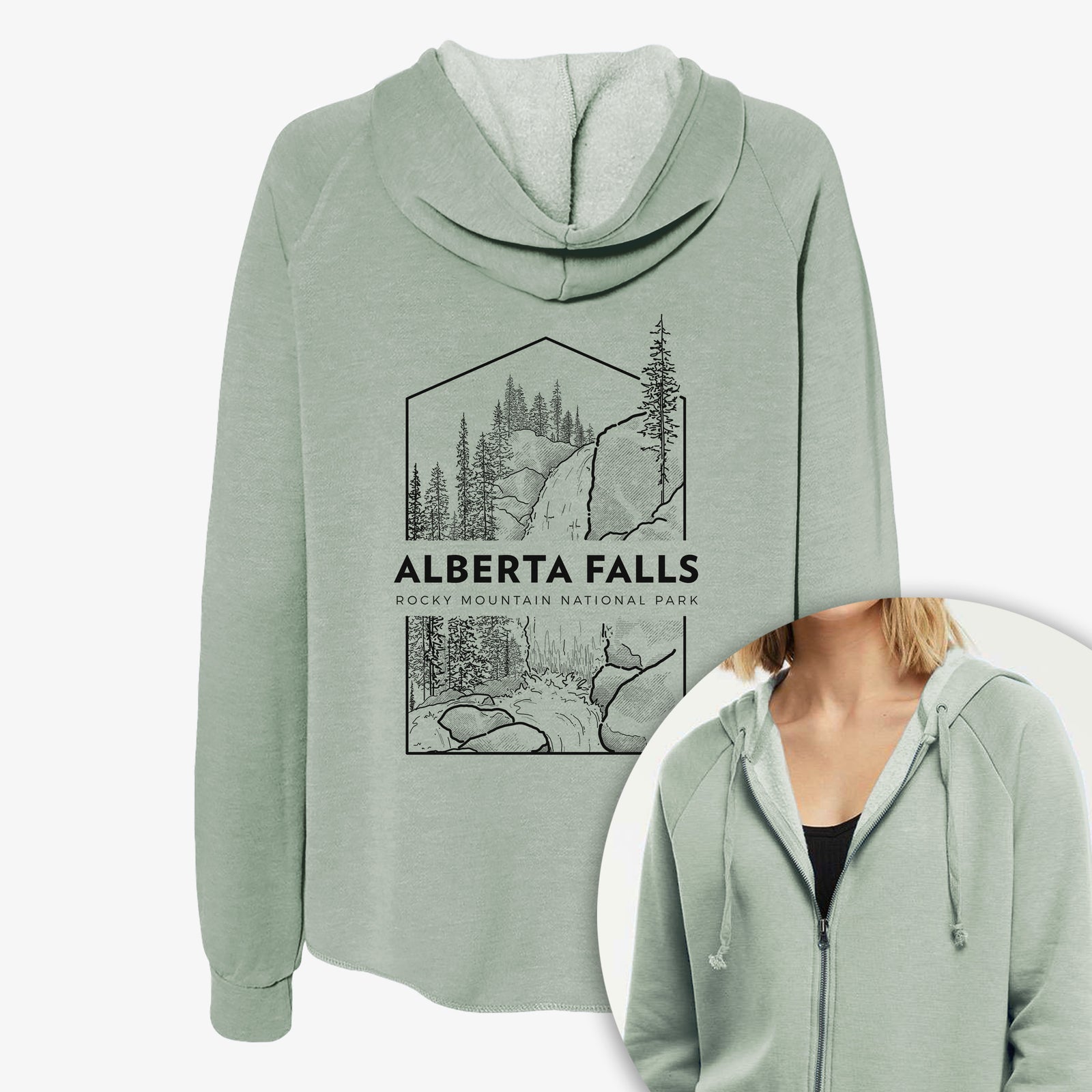 Women's Cali Wave zip-up sweatshirt printed with a black line art badge of Alberta Falls with pine trees, with the words Alberta Falls, Rocky Mountain National Park, with a close-up of the zipper.