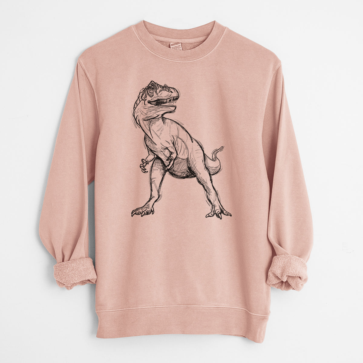 Dusty pink pigment dyed crewneck sweatshirt laid flat with the sleeves rolled, printed with a black ink illustration of an Allosaurus walking.