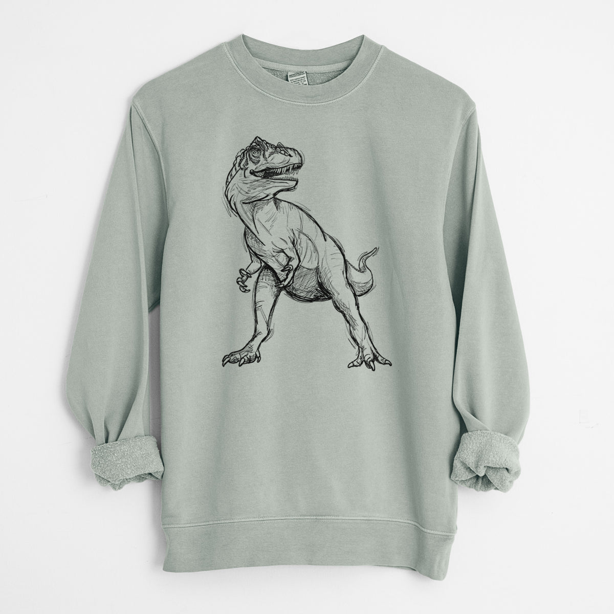 Sage green pigment dyed crewneck sweatshirt laid flat with the sleeves rolled, printed with a black ink illustration of an Allosaurus walking.