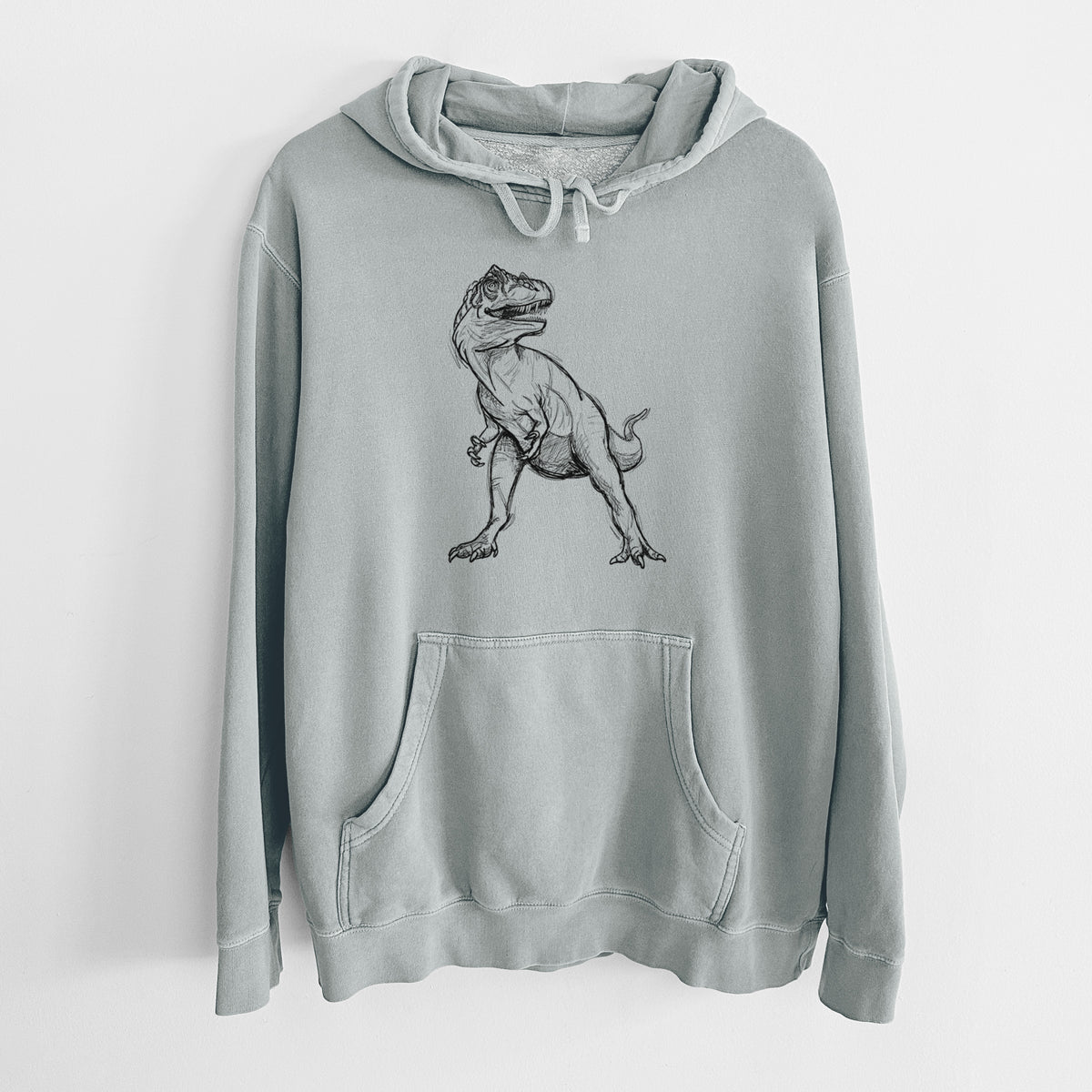 Sage green pigment dyed hoodie laid flat, printed with a black ink illustration of an Allosaurus walking.
