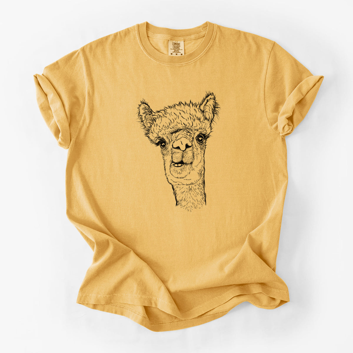 Golden wheat yellow Comfort Colors t-shirt laid flat, printed with a detailed black ink portrait of a fluffy alpaca's head and neck.