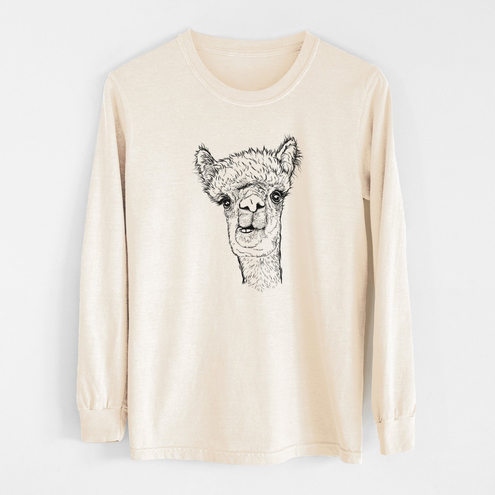 Ivory Comfort Colors long sleeve shirt laid flat, printed with a detailed black ink portrait of a fluffy alpaca's head and neck.