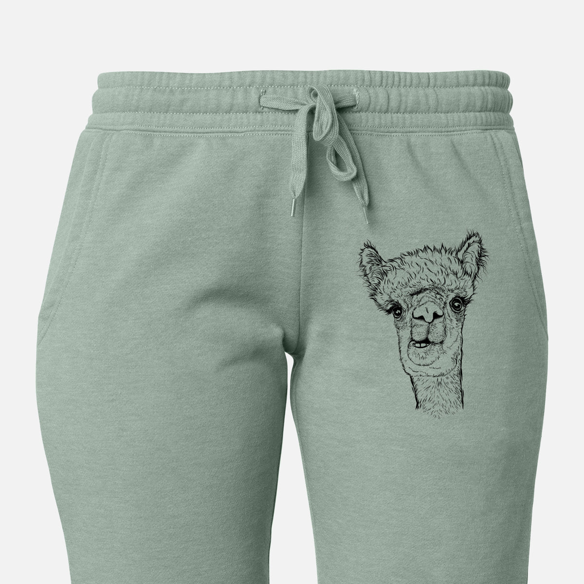 Front of sage green Cali Wave sweatpants, printed with a detailed black ink portrait of a fluffy alpaca's head and neck on the leg.