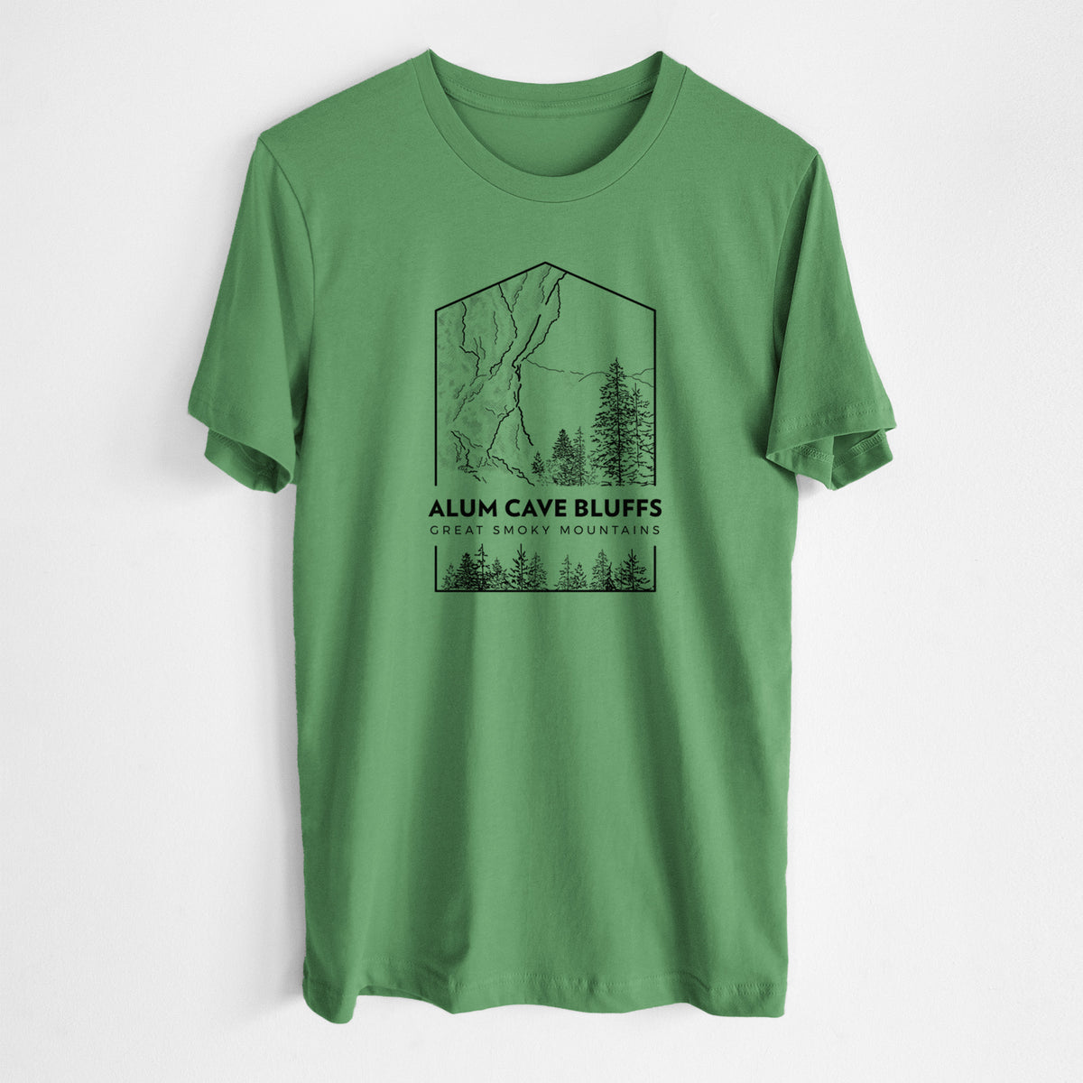 Leaf green lightweight cotton t-shirt laid flat, printed with a black line art badge of Alum Cave Bluffs with pine trees, with the words Alum Cave Bluffs, Great Smoky Mountains.