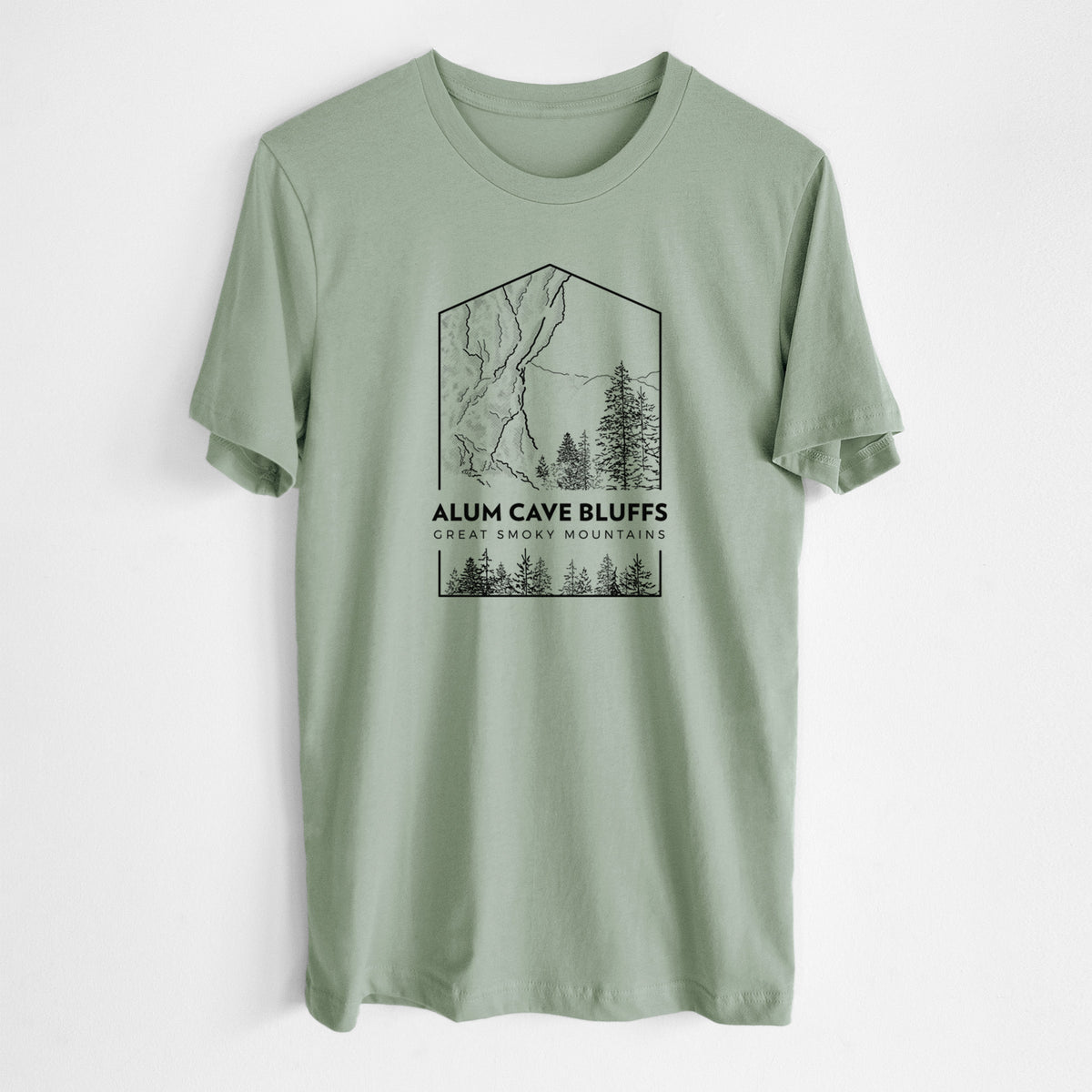 Sage green lightweight cotton t-shirt laid flat, printed with a black line art badge of Alum Cave Bluffs with pine trees, with the words Alum Cave Bluffs, Great Smoky Mountains.