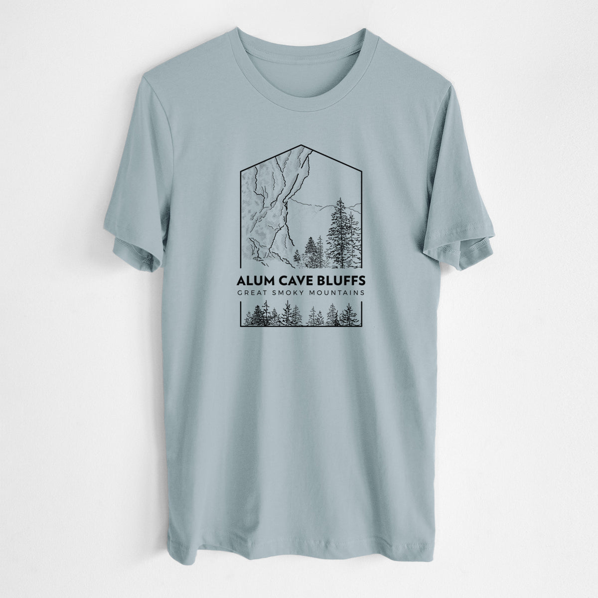 Vintage denim lightweight cotton t-shirt laid flat, printed with a black line art badge of Alum Cave Bluffs with pine trees, with the words Alum Cave Bluffs, Great Smoky Mountains.