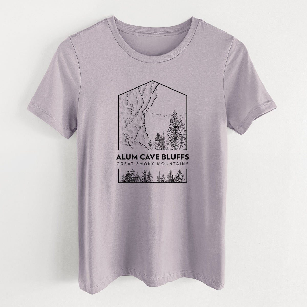 Light violet women's relaxed fit cotton t-shirt laid flat, printed with a black line art badge of Alum Cave Bluffs with pine trees, with the words Alum Cave Bluffs, Great Smoky Mountains.