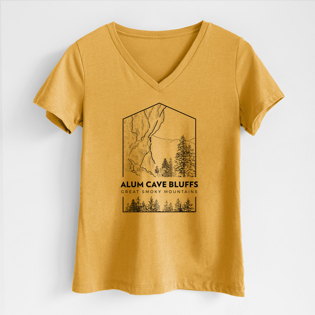 Honeycomb yellow women's relaxed fit cotton V-neck t-shirt laid flat, printed with a black line art badge of Alum Cave Bluffs with pine trees, with the words Alum Cave Bluffs, Great Smoky Mountains.