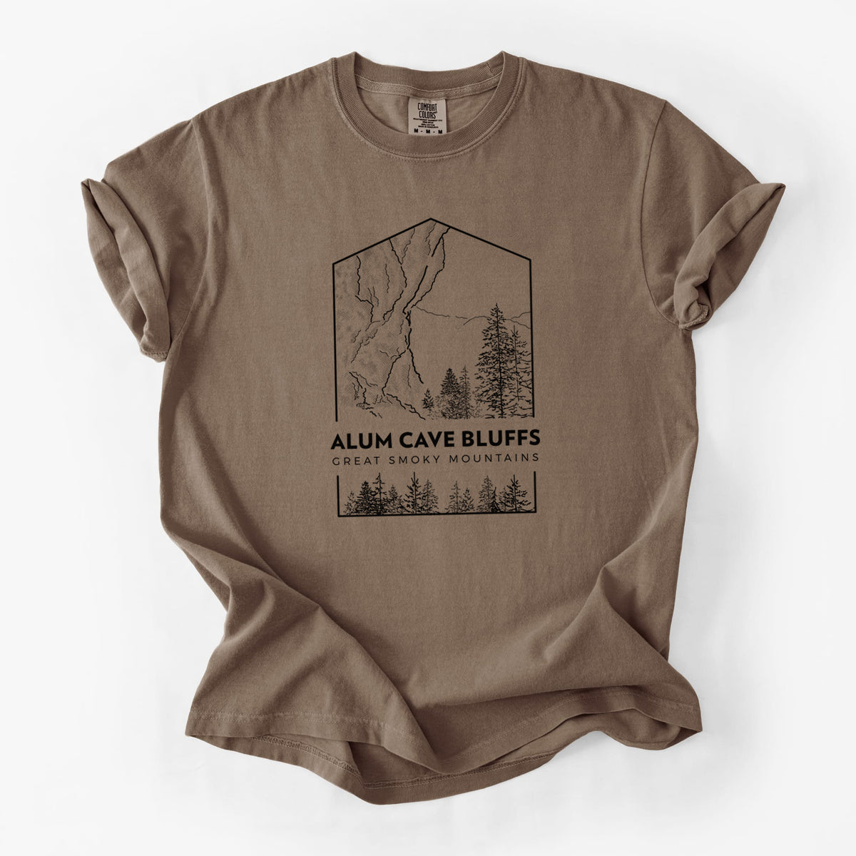 Espresso brown Comfort Colors t-shirt laid flat, printed with a black line art badge of Alum Cave Bluffs with pine trees, with the words Alum Cave Bluffs, Great Smoky Mountains.