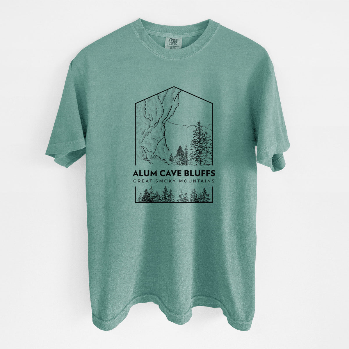 Reef green Comfort Colors t-shirt laid flat, printed with a black line art badge of Alum Cave Bluffs with pine trees, with the words Alum Cave Bluffs, Great Smoky Mountains.