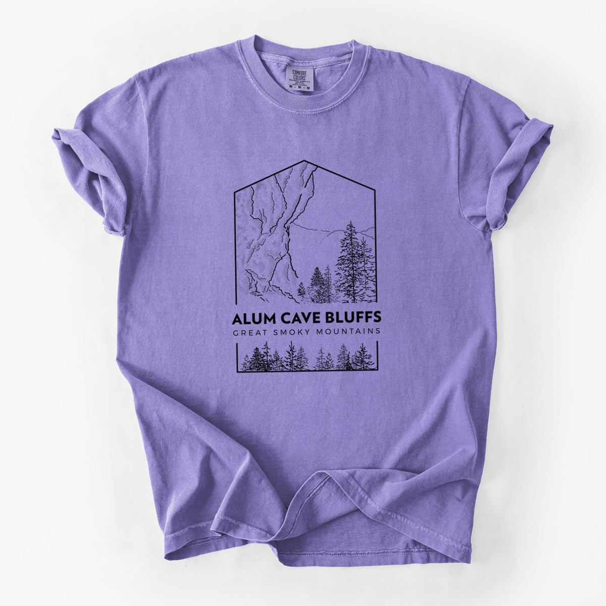 Violet purple Comfort Colors t-shirt laid flat, printed with a black line art badge of Alum Cave Bluffs with pine trees, with the words Alum Cave Bluffs, Great Smoky Mountains.