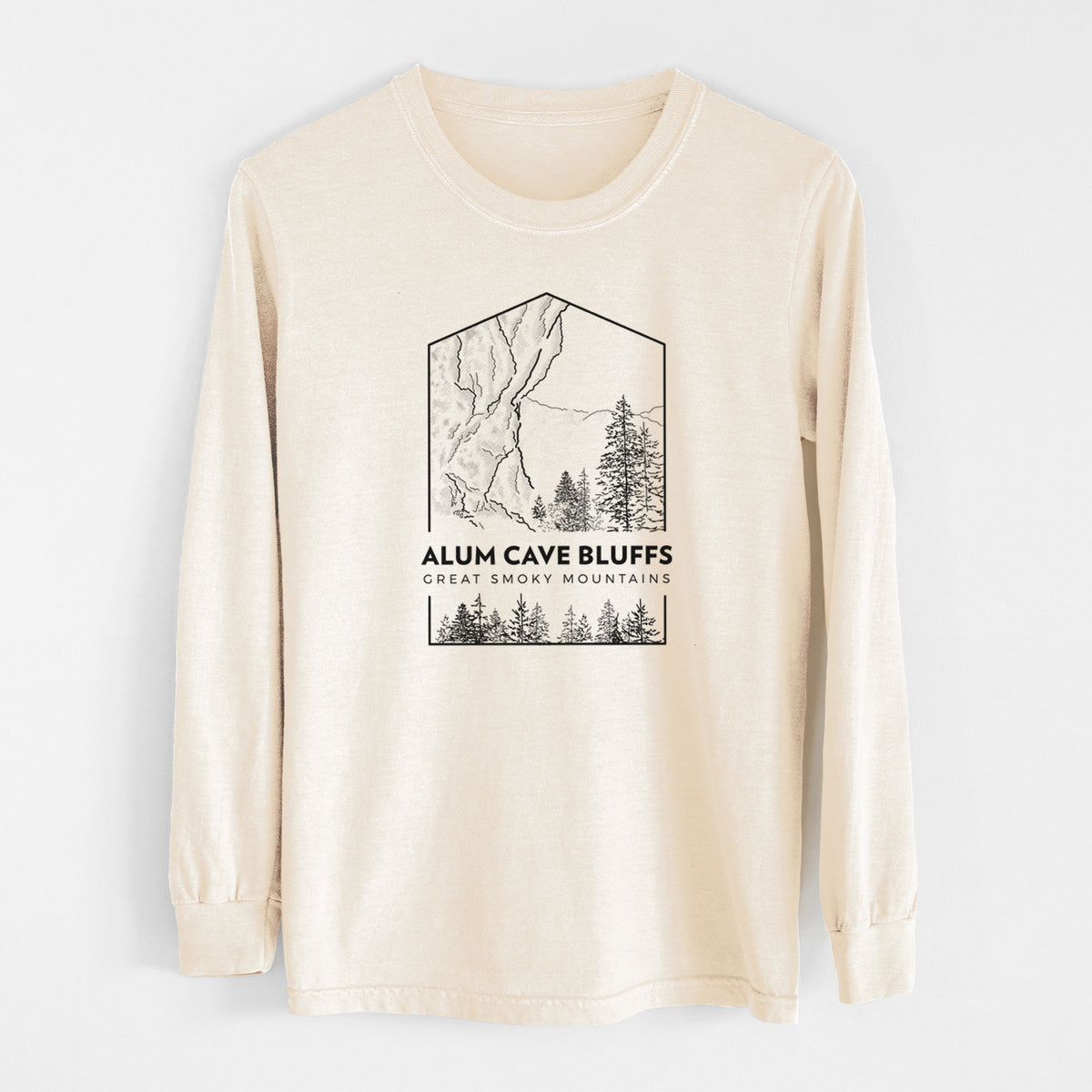 Ivory Comfort Colors long sleeve shirt laid flat, printed with a black line art badge of Alum Cave Bluffs with pine trees, with the words Alum Cave Bluffs, Great Smoky Mountains.