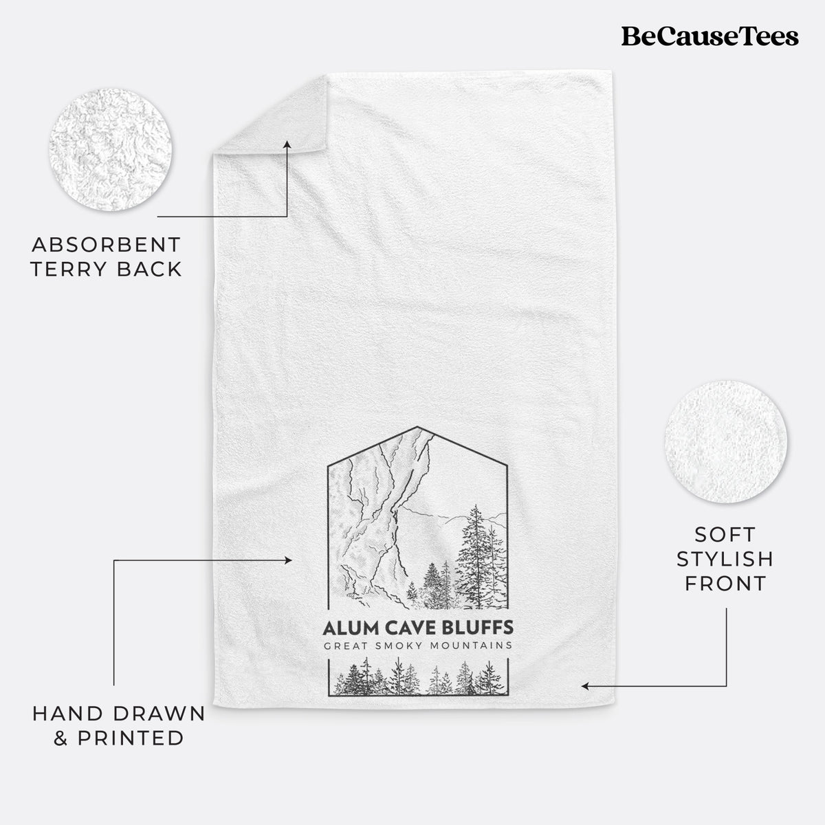 White hand towel printed with a black line art badge of Alum Cave Bluffs with pine trees, with the words Alum Cave Bluffs, Great Smoky Mountains.