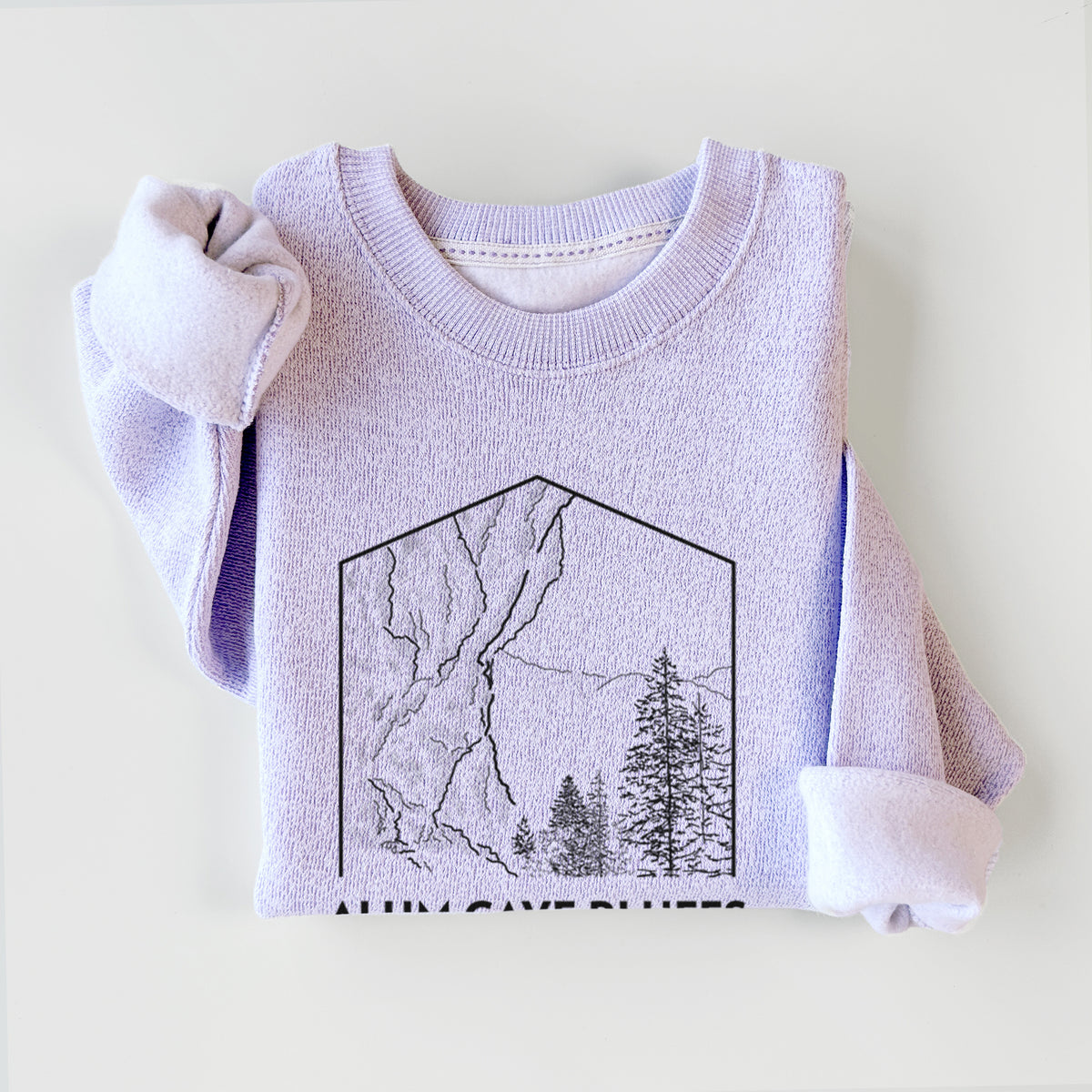 Ice purple knit sweatshirt printed with a black line art badge of Alum Cave Bluffs with pine trees, with the words Alum Cave Bluffs, Great Smoky Mountains, styled flat.