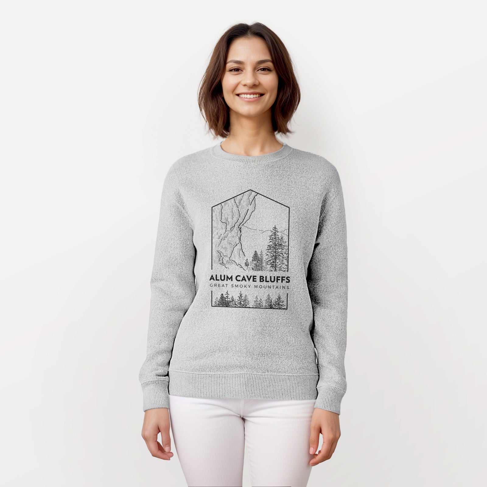 Salt and pepper knit sweatshirt laid flat, printed with a black line art badge of Alum Cave Bluffs with pine trees, with the words Alum Cave Bluffs, Great Smoky Mountains.