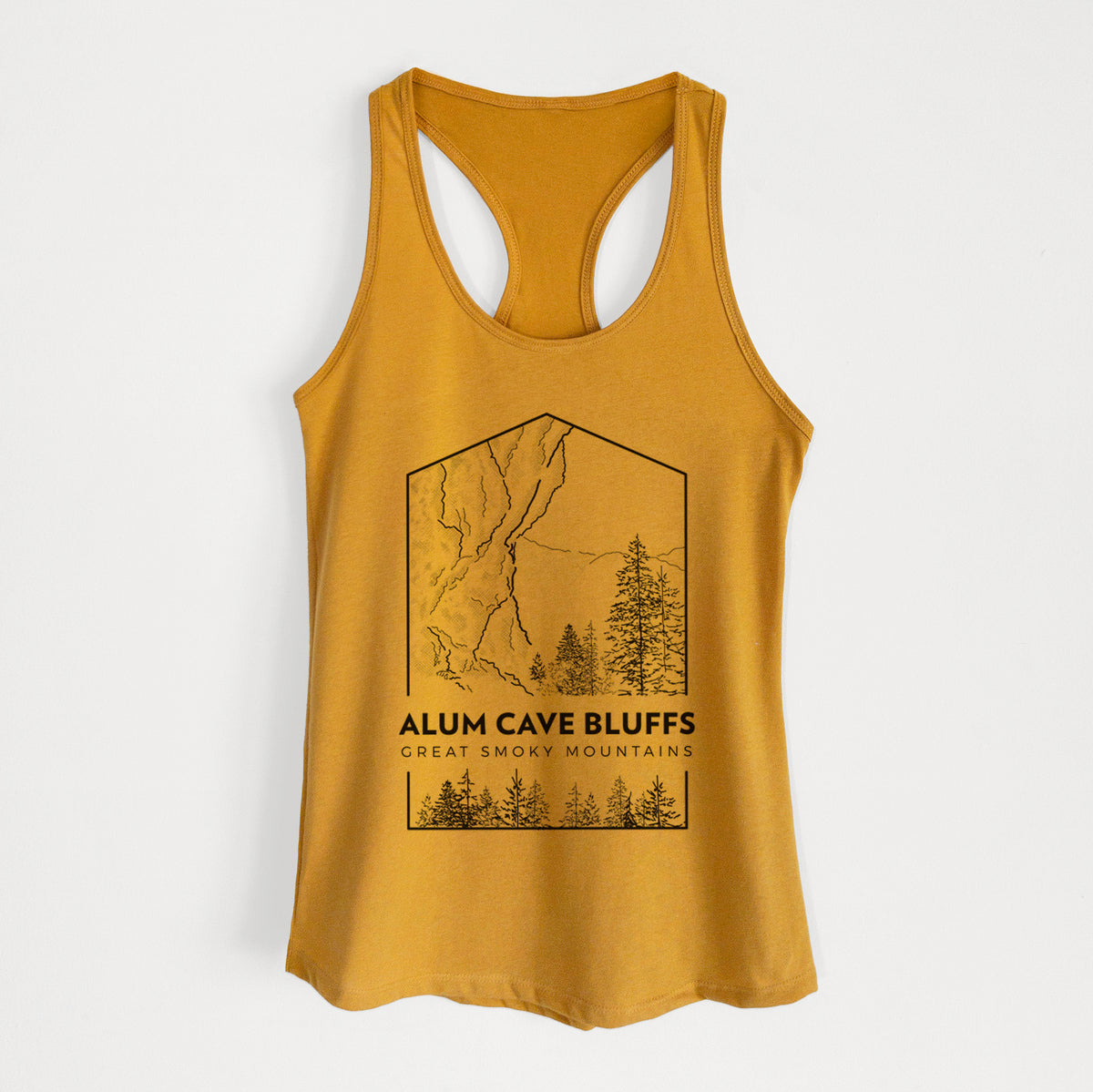 Gold women's racerback tank top laid flat, printed with a black line art badge of Alum Cave Bluffs with pine trees, with the words Alum Cave Bluffs, Great Smoky Mountains.
