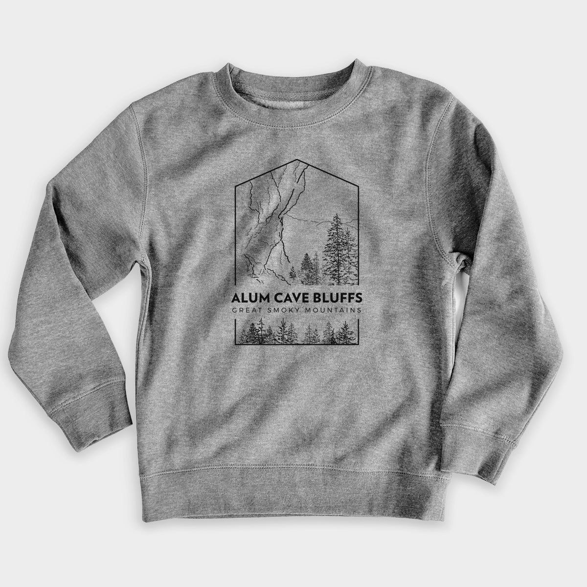 Nickel grey youth crewneck sweatshirt laid flat, printed with a black line art badge of Alum Cave Bluffs with pine trees, with the words Alum Cave Bluffs, Great Smoky Mountains.