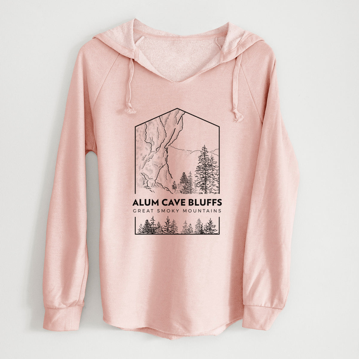 Blush pink women's Cali Wave hooded sweatshirt laid flat, printed with a black line art badge of Alum Cave Bluffs with pine trees, with the words Alum Cave Bluffs, Great Smoky Mountains.