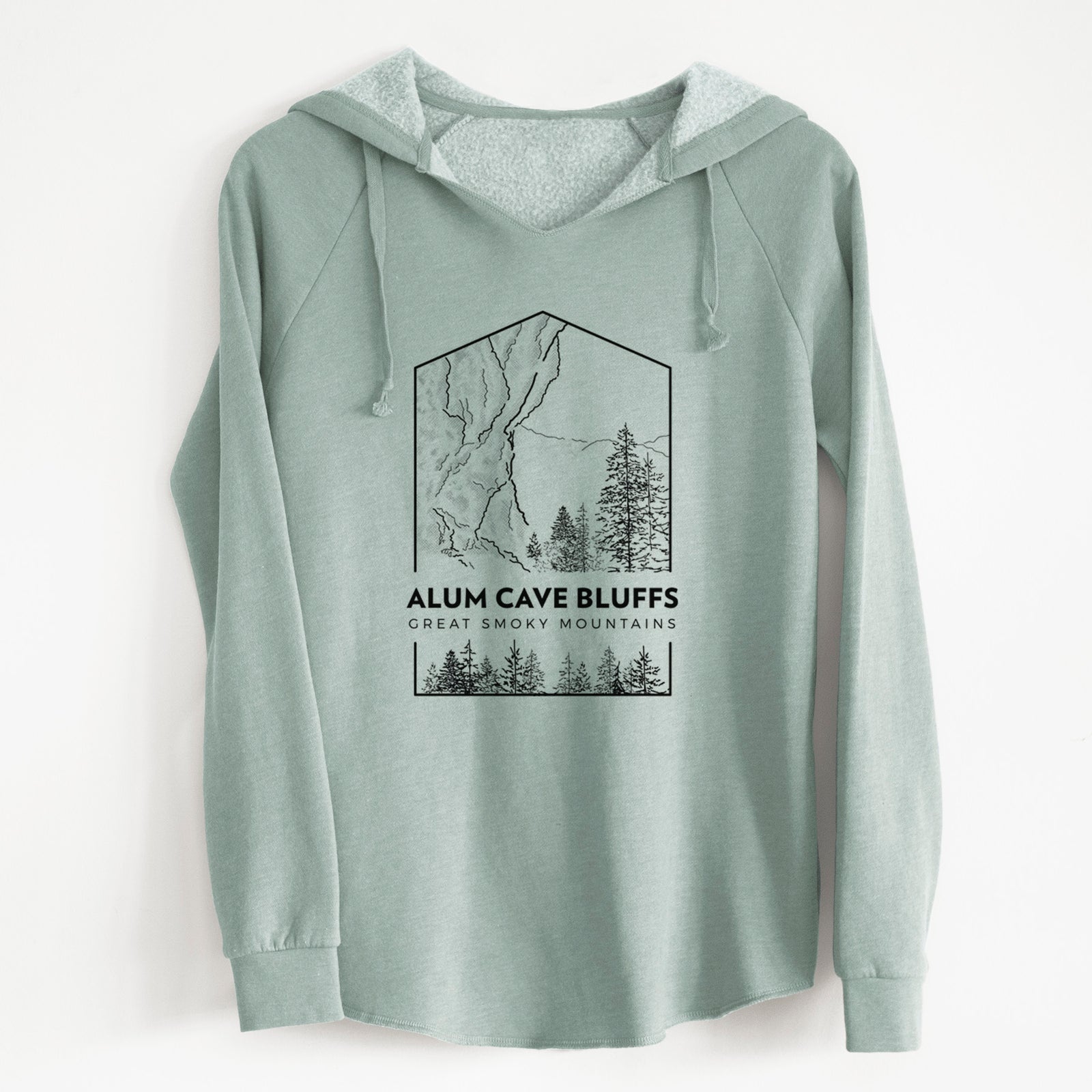 Sage green women's Cali Wave hooded sweatshirt laid flat, printed with a black line art badge of Alum Cave Bluffs with pine trees, with the words Alum Cave Bluffs, Great Smoky Mountains.